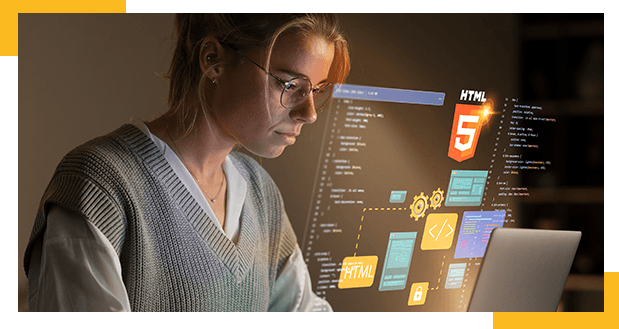 czego-sie-nauczysz-na-kursie Uczestniczka kursu programowania w Coders Lab przy komputerze